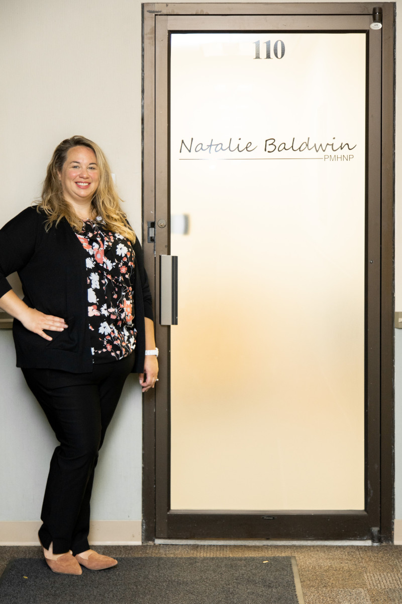 natalie_standing_at_office_door